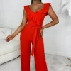 SOFT TOUCH Radiant Senorita Orange Wrap Over Ruffle Wide Leg Belted Jumpsuit<Women Jumpsuits